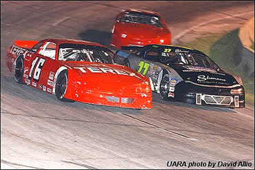Sunoco Polesitter (16) Wayne Grubb and (27) Lee Tissot dueled side-by-side for the lead in the Anderson 150 UARA Late Model Stock Car feature at Anderson Motor Speedway